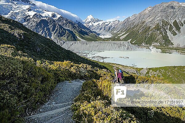 Hiker on a trail  view of Hooker Valley with Mueller Lake  Hooker Lake and Mount Cook  Sealy Tarns Track  Hooker Valley  Mount Cook National Park  Southern Alps  Canterbury  South Island  New Zealand  Oceania