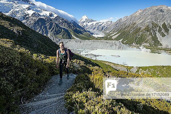 Hiker on a trail  view of Hooker Valley with Mueller Lake  Hooker Lake and Mount Cook  Sealy Tarns Track  Hooker Valley  Mount Cook National Park  Southern Alps  Canterbury  South Island  New Zealand  Oceania
