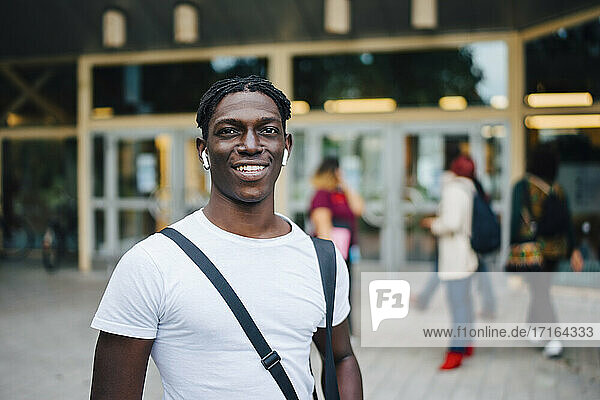 Portrait of smiling African student in campus