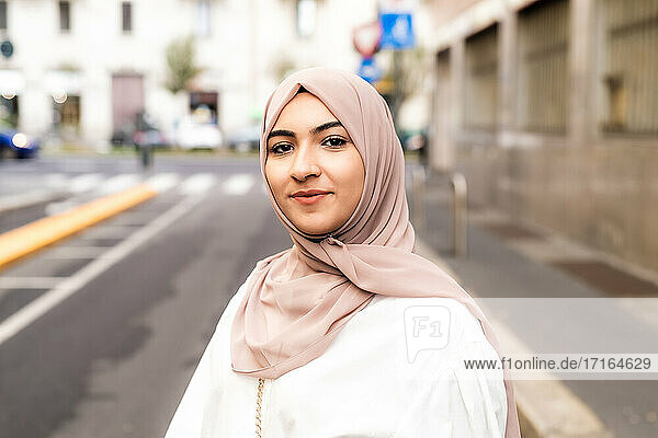 Street portrait of young woman wearing hijab