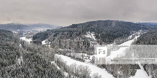 Drone view of forested Remstal valley in winter