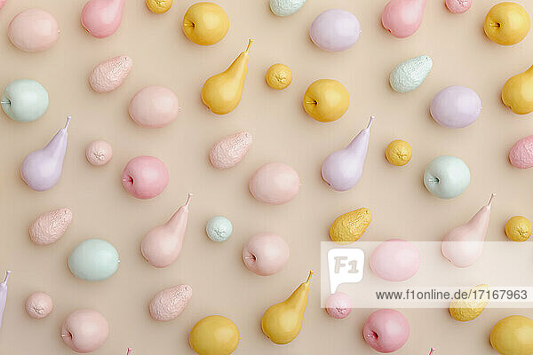 Three dimensional render of pastel colored fruits