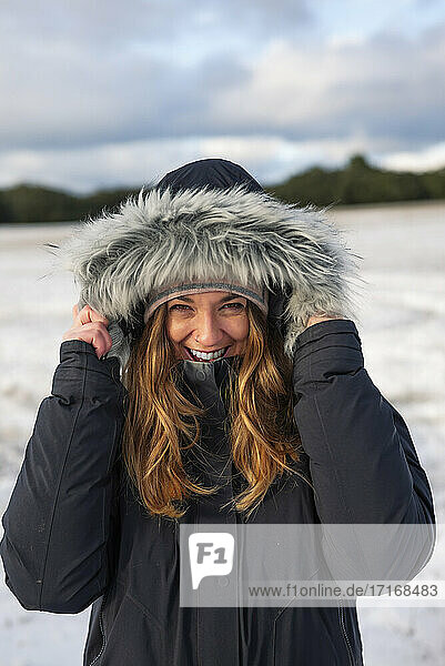 Happy beautiful woman in warm clothing during winter