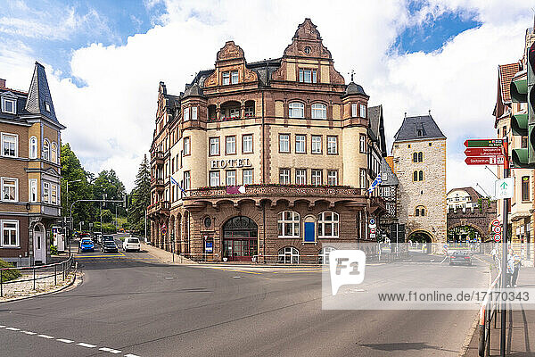 Historic hotel by station against cloudy sky at Bahnhof street and Karl Square in Eisenach  Germany