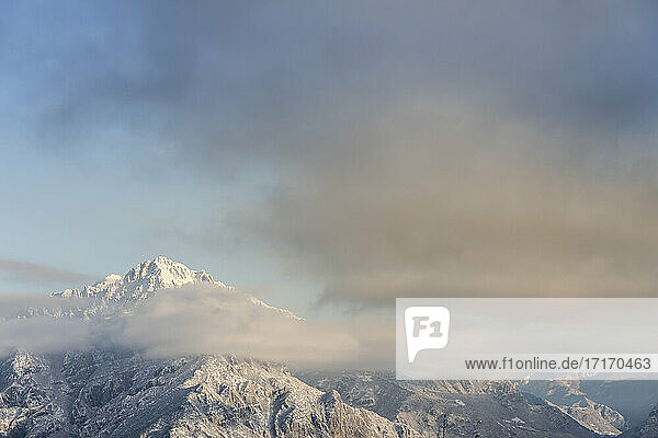 Cloudscape over snowcapped mountain at Orobic Alps  Lecco  Italy