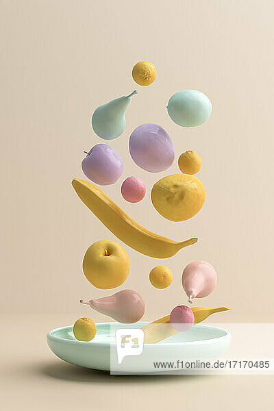 Three dimensional render of pastel colored fruits falling on plate
