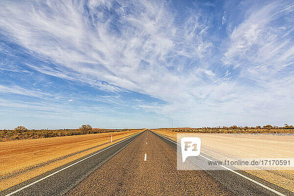 Sky over empty Lasseter Highway  Australia