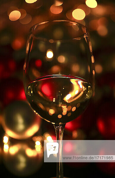 Wineglass reflecting Christmas lights