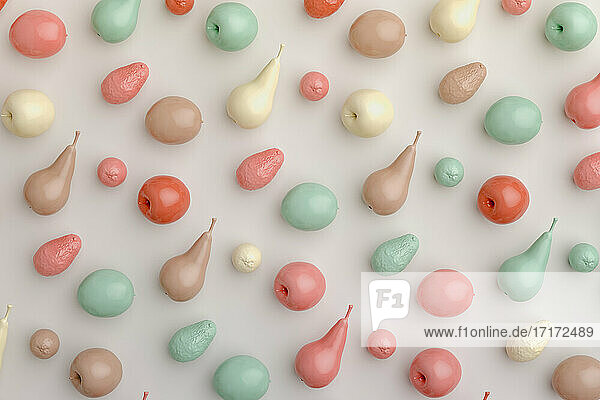 Three dimensional render of pastel colored fruits