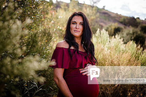 Expectant Mother Posing in Field in San Diego
