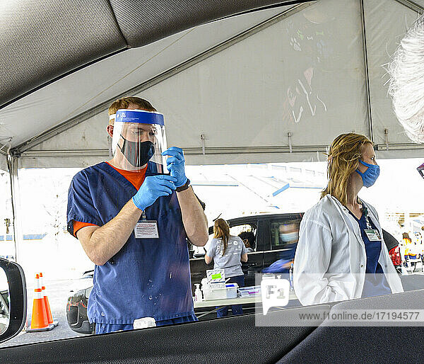 A nurse prepares a syringe at a Vaccine distribution center in Hoover  Alabama organized by the University of Alabama  Birmingham  UAB.