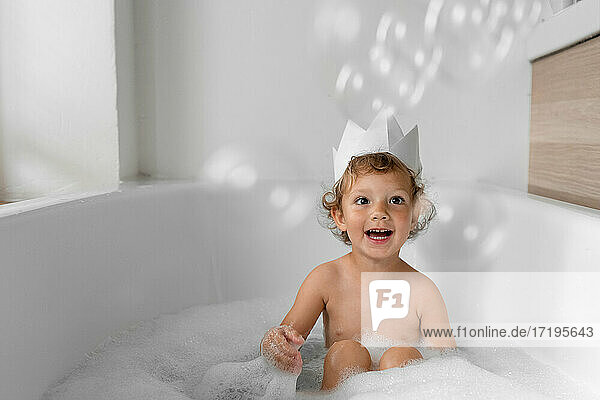 girl has fun in the bathtub