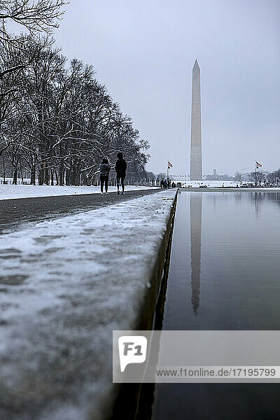 Snow blankets the National Mall and Washington Monument.