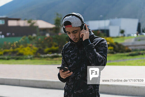 Young man listening to music for exercise.