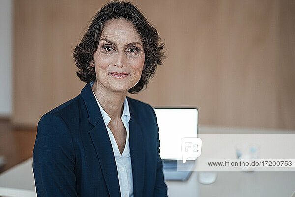 Smiling businesswoman at home office