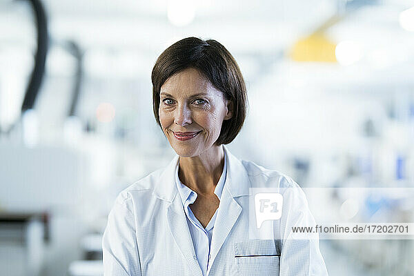 Smiling female scientist at laboratory