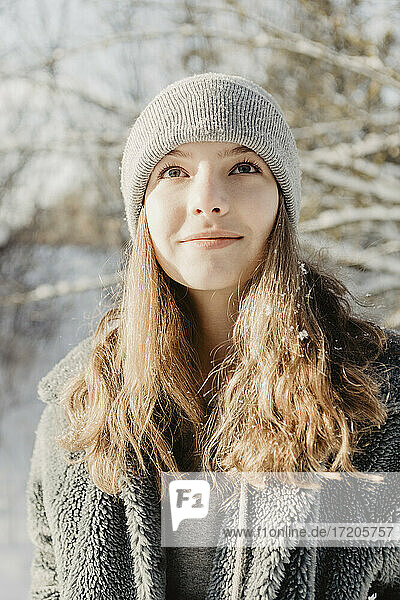 Portrait of beautiful teenage girl wearing knit hat