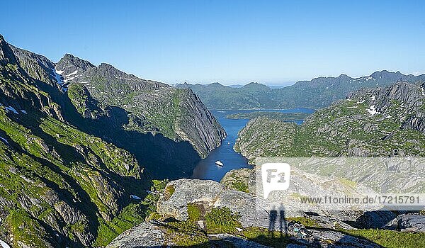 Two shadows of hikers  boat in fjord Trollfjord  mountains and Raftsund  Lofoten  Nordland  Norway  Europe