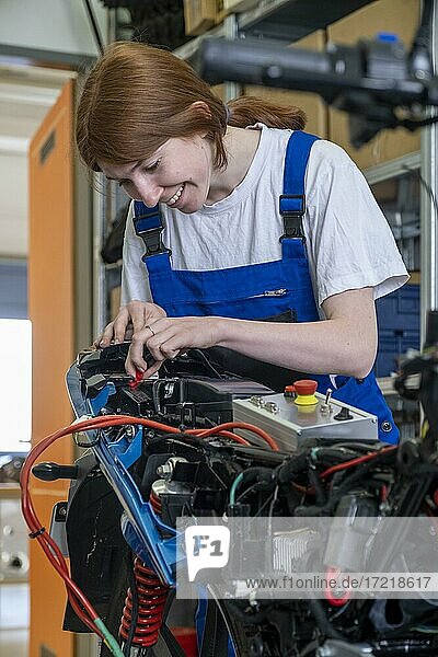 Training center  female apprentice  automotive mechatronics technician  trainee  electronics  technology  Bavaria  Germany  Europe