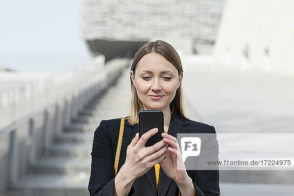Female entrepreneur using smart phone