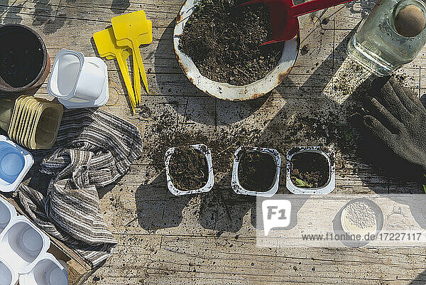 Mud and gardening equipment on table during springtime