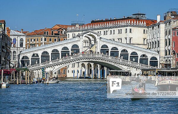 Gondola with tourists on the Grand Canal  Rialto Bridge  Venice  Veneto  Italy  Europe