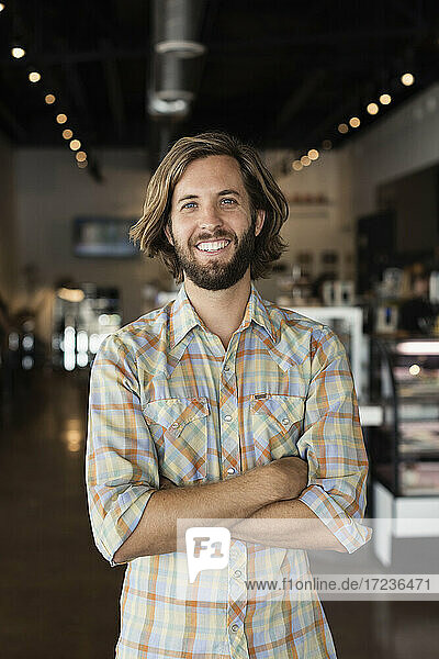 Portrait of mid adult man in coffee shop
