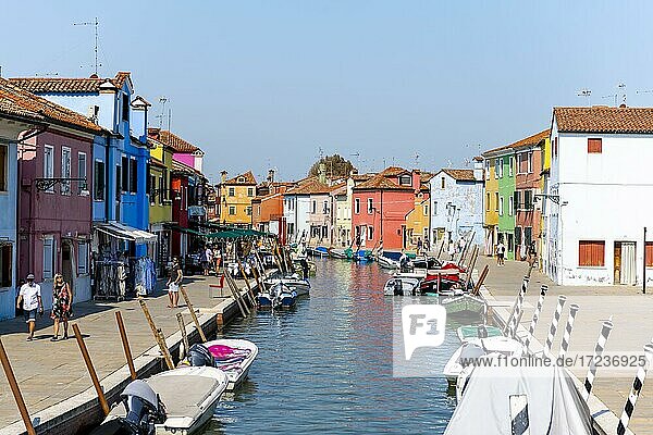 Canal with boats  Colorful houses  Colorful facade  Burano island  Venice  Veneto  Italy  Europe