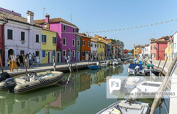 Canal with boats  Colorful houses  Colorful facade  Burano island  Venice  Veneto  Italy  Europe