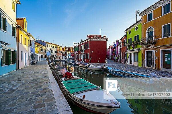 Canal with boats  Colorful houses  Colorful facades  Burano Island  Venice  Veneto  Italy  Europe