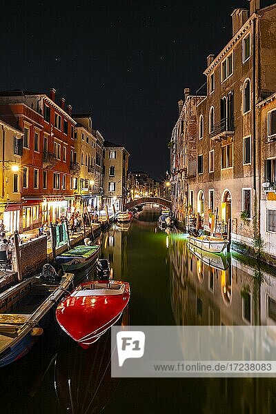 Evening atmosphere  streetlights  boats on canal and historical buildings  Venice  Veneto  Italy  Europe