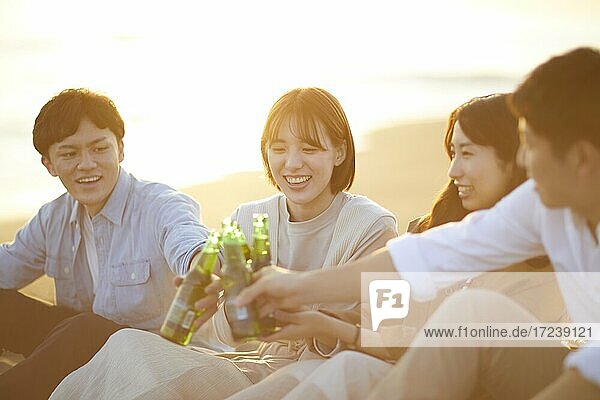 Young Japanese friends at the beach