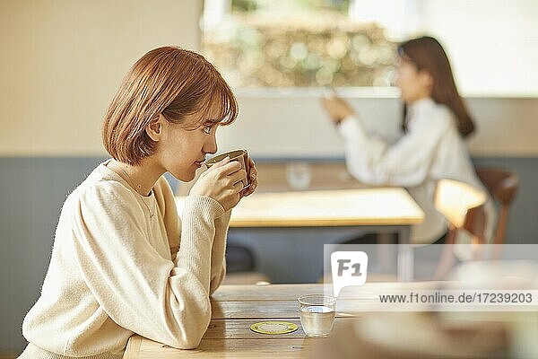Young Japanese woman at a cafe