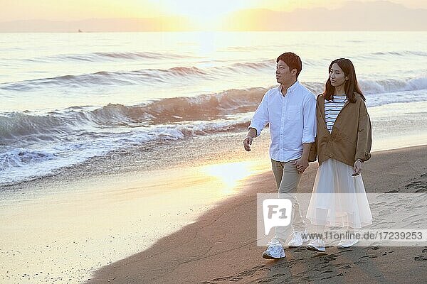 Young Japanese couple at the beach