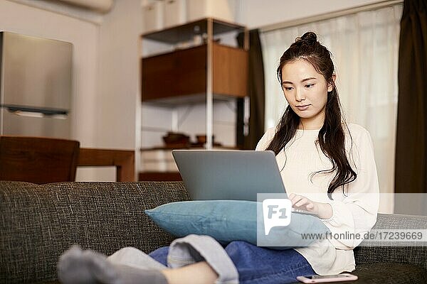 Young Japanese woman at home