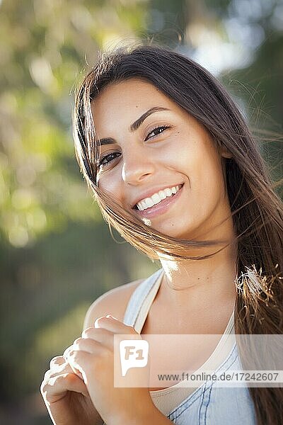 Beautiful mixed-race young woman portrait outside