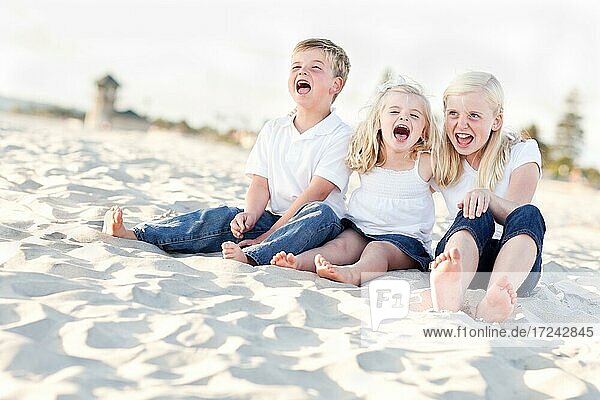 Adorable sibling children at the beach