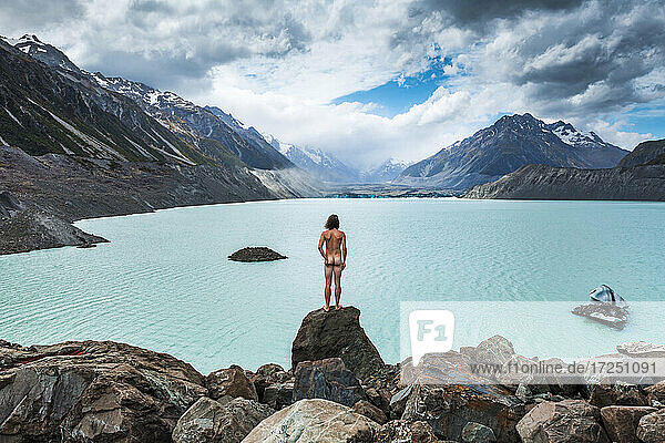 New Zealand  Canterbury  Rear view of naked man looking at Tasman Lake