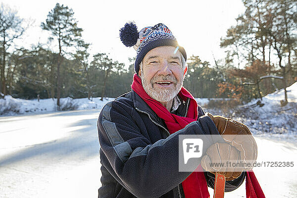 Man with knit hat on snow during sunny day