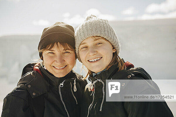 Portrait of smiling mother and daughter during vacations