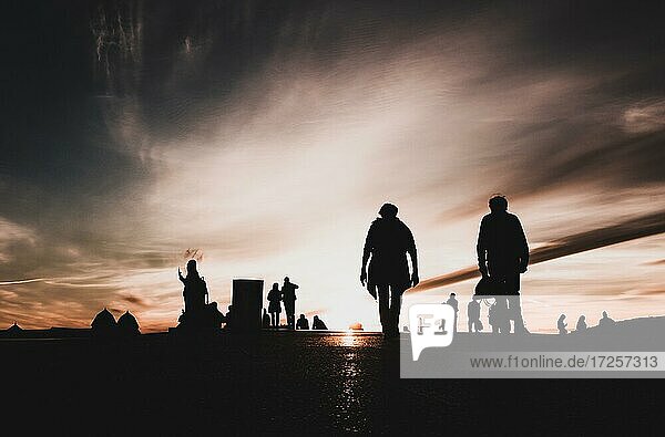Sunset  silhouettes of the people  Oslo  Norway  Europe