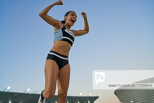 Excited track and field athlete celebrating victory