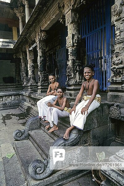 Three Dikshit boys sitting on the steps in Nataraja temple  Chidambaram  Tamil Nadu  India  Asia