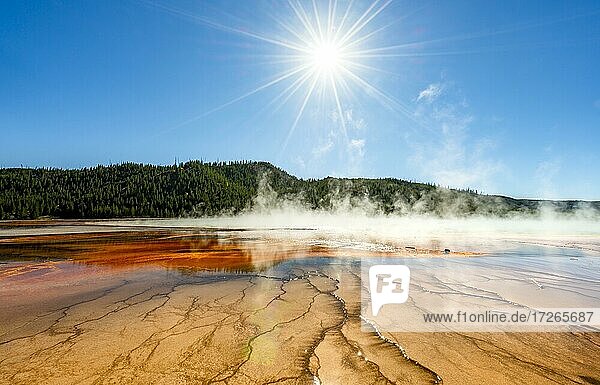 Steaming hot spring with sun star  Colored mineral deposits  Grand Prismatic Spring  Midway Geyser Basin  Yellowstone National Park  Wyoming  USA  North America