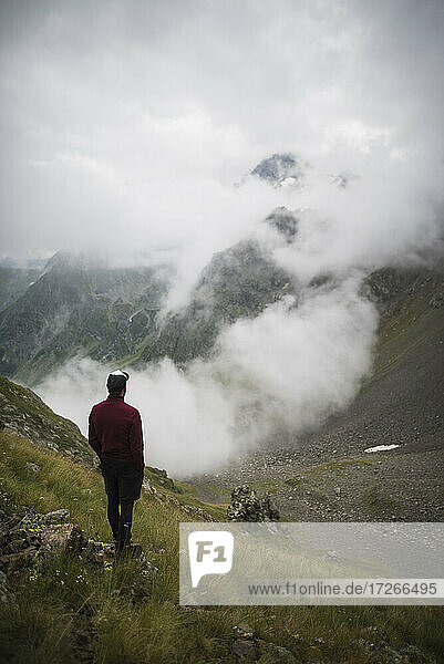 Switzerland  Appenzell  Man hiking in Swiss Alps