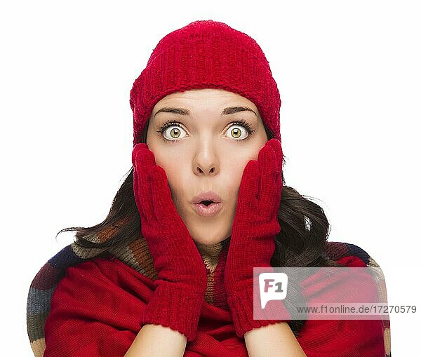 Expressive mixed-race woman wearing winter hat and gloves isolated on white background
