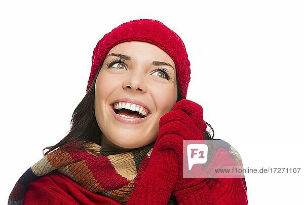 Happy mixed-race woman wearing winter hat and gloves looking to the side isolated on white background