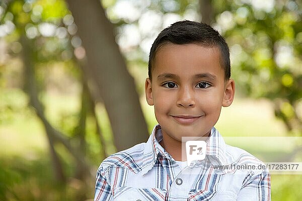Handsome young hispanic boy having fun in the park
