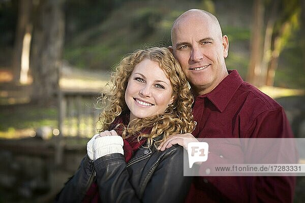 Loving daughter and father portrait in the park