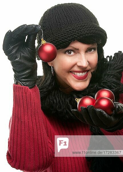 Attractive woman holding christmas ornaments isolated on a white background
